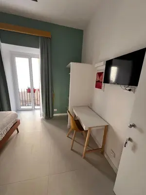 TV o dispositivi per l'intrattenimento presso Bed & Breakfast SpaccaNapoli 56