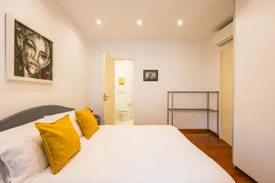 Letto o letti in una camera di Colonna Classic Style Apartment by Wonderful Italy