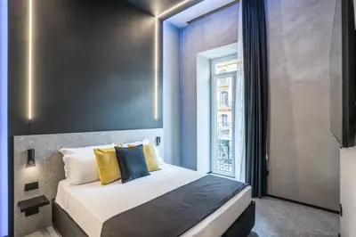 Letto o letti in una camera di Gallery Experience Napoli