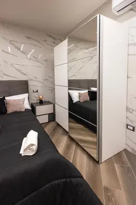 Letto o letti in una camera di Fermata San Gennaro