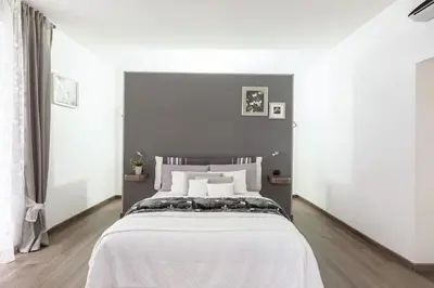 Letto o letti in una camera di CASABARINA live in the Center of Naples