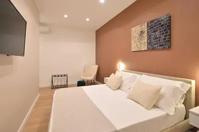 Letto o letti in una camera di Ponte di Tappia Suites