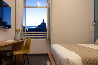 Letto o letti in una camera di MAIN - Duomo