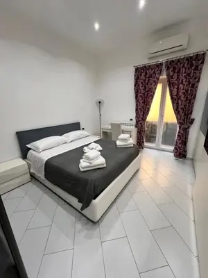 Letto o letti in una camera di Napoli inn station