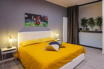 Letto o letti in una camera di Napoli Games Apartments by Dimorra