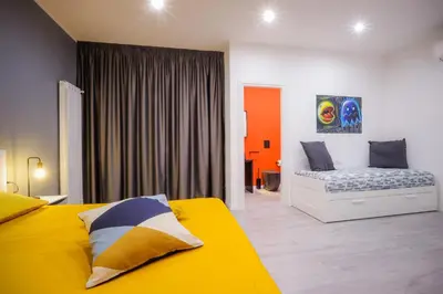 Letto o letti in una camera di Napoli Games Apartments by Dimorra