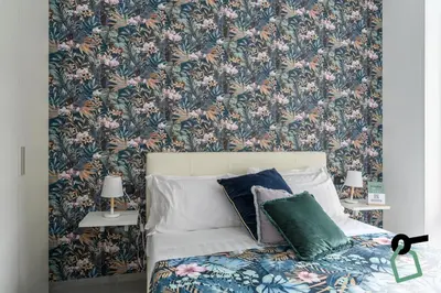 Letto o letti in una camera di Hotiday Room Collection - Napoli Sant'Arcangelo
