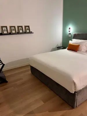 Letto o letti in una camera di La casa di Nelly Boutique Apartment Napoli