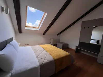 Letto o letti in una camera di Unonoveuno Luxury Apartment