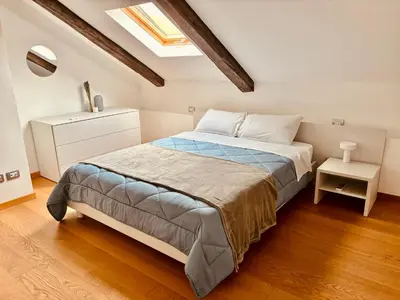 Letto o letti in una camera di Unonoveuno Luxury Apartment