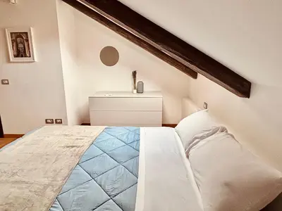 Letto o letti in una camera di Unonoveuno Luxury Apartment