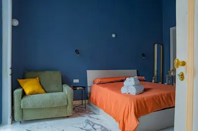 Letto o letti in una camera di Filomena Suites