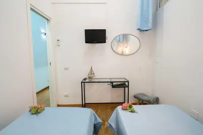 Letto o letti in una camera di New In! Rose a Santa Lucia