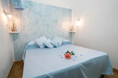 Letto o letti in una camera di New In! Rose a Santa Lucia