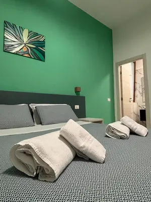 Letto o letti in una camera di B&B CADIFRA Portapiccola