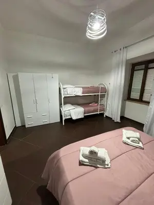 Letto o letti in una camera di Napoli Olè suite