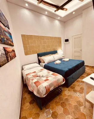 Letto o letti in una camera di Residenza degli Spagnoli