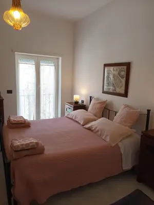 Letto o letti in una camera di Casa Vacanze nel Cuore di Napoli