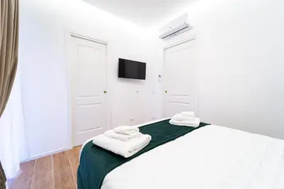 Letto o letti in una camera di Royal San Paolo - Roots Partenopee