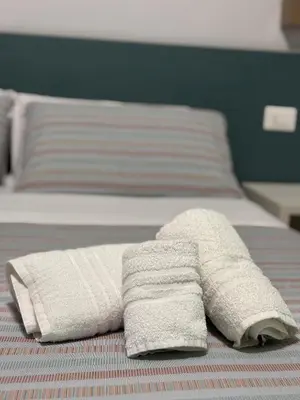 Letto o letti in una camera di CADIFRA Suite Napoli Toledo