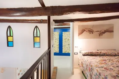 Letto o letti in una camera di La Casetta sui Gradoni, nel cuore del centro