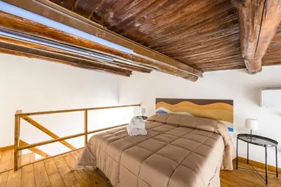 Letto o letti in una camera di Carrozzieri Nest at Historical Center