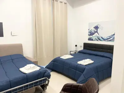 Letto o letti in una camera di Napolidays Rua Catalana Apartment