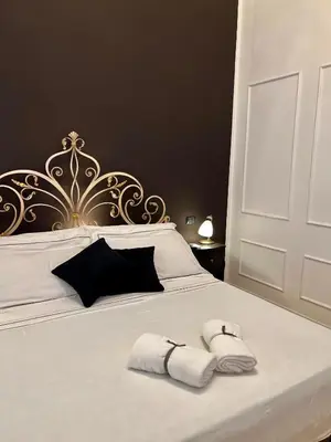 Letto o letti in una camera di Fiorentine Relais