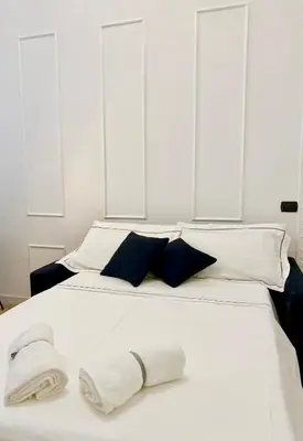Letto o letti in una camera di Fiorentine Relais