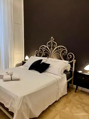 Letto o letti in una camera di Fiorentine Relais