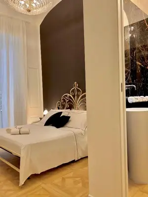 Letto o letti in una camera di Fiorentine Relais