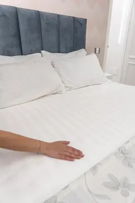Letto o letti in una camera di Suite d'élite Chiaia