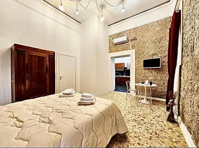 Letto o letti in una camera di La Dimora di Mary