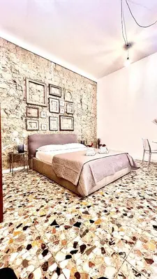 Letto o letti in una camera di La Suite di Marco