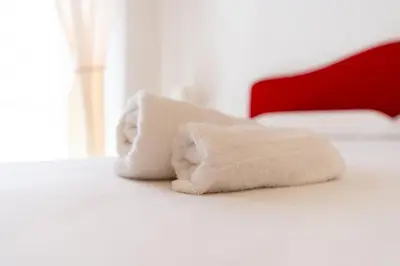 Letto o letti in una camera di Tombolata
