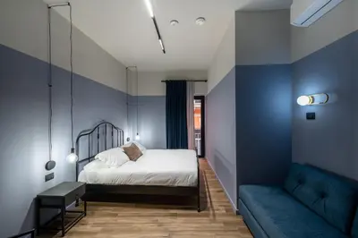 Letto o letti in una camera di RB Suites Napoli