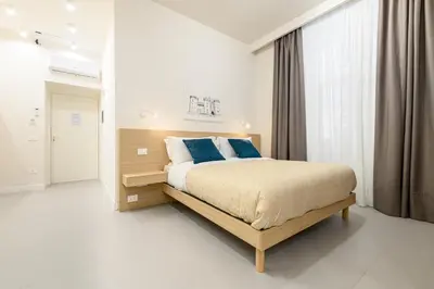 Letto o letti in una camera di Dimora Joseph VIA TOLEDO