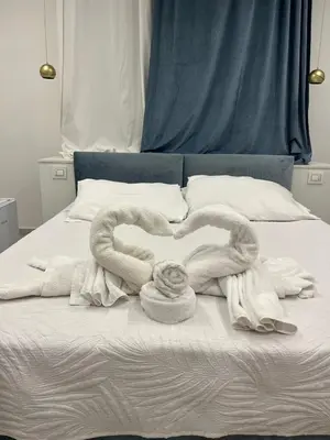 Letto o letti in una camera di Luxury Masaniello