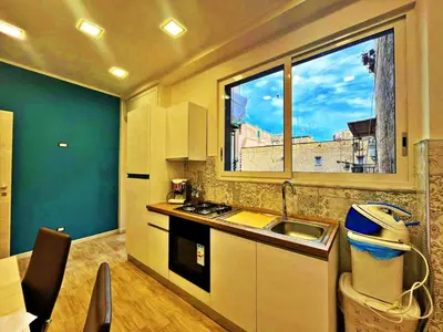 Cucina o angolo cottura di La Dolce Vita Napoletana Luxury Historic Center Apartment