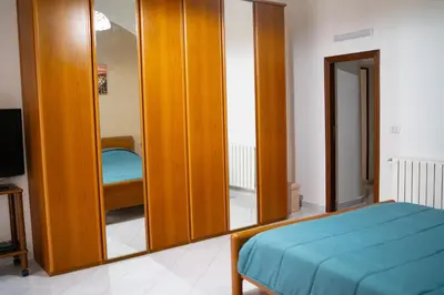 Letto o letti in una camera di AUTENTICA NAPOLI HOME