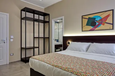 Letto o letti in una camera di Palm Suites
