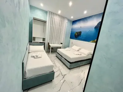 Letto o letti in una camera di DUOMO MIRADOIS 152 NAPOLI