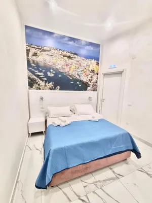 Letto o letti in una camera di DUOMO MIRADOIS 152 NAPOLI