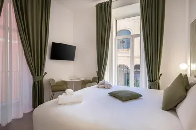 Letto o letti in una camera di VistaVicolo Rooms