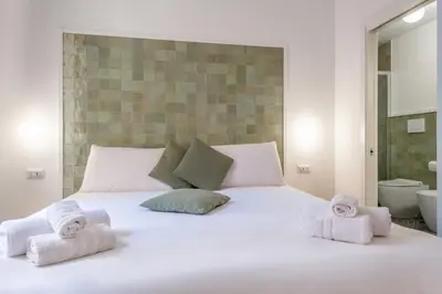 Letto o letti in una camera di VistaVicolo Rooms