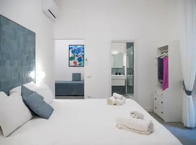 Letto o letti in una camera di VistaVicolo Rooms