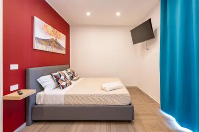 Letto o letti in una camera di R&D Scassacocchi apartments 15