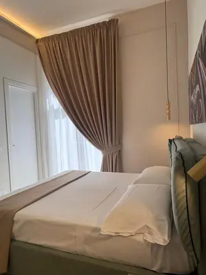 Letto o letti in una camera di Dimora Don Pasquale Napoli