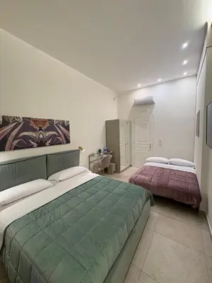 Letto o letti in una camera di Dimora Don Pasquale Napoli