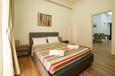 Letto o letti in una camera di Portanova14 - Historic Center Apartment